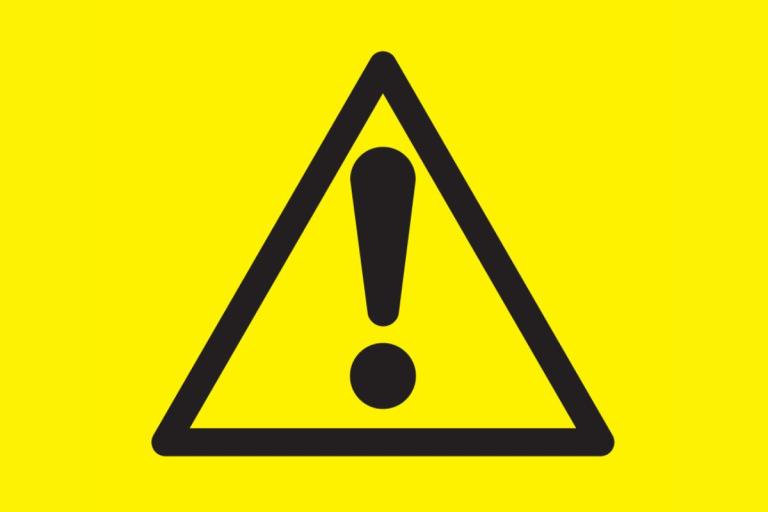 Icon of black exclamation mark in a black triangle on a yellow background.