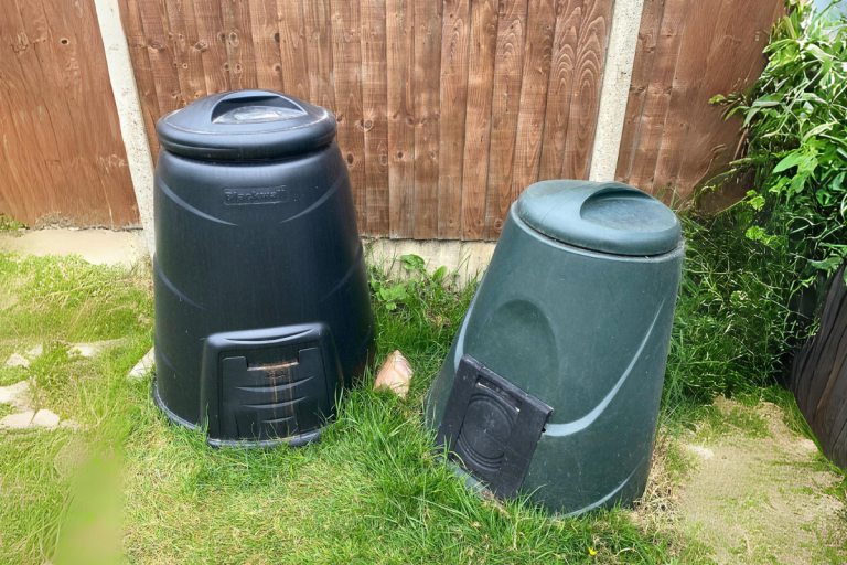 Two dalek compost bins in garden