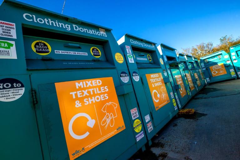 Textile recycling bins at a recycling centre.