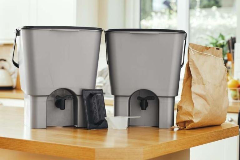 Two bokashi bins on a table