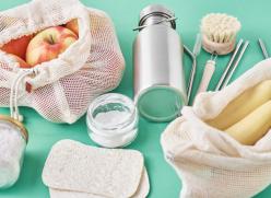 Selection of plastic free products on a green surface.