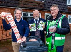 Councillor Peter Schwier, Councillor Bob Massey and an employee from Letterbox Distribution pictured outside an Essex household holding the stickers, leaflets and compostable liners delivered to all eligible households in Essex for the Food Recycling Project.