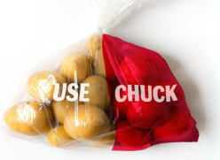 Bag of potatoes with use and chuck written on top. Half the bag is red to indicate amount wasted.