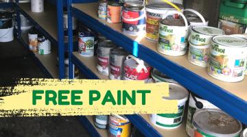 An image of some shelving containing several tins of partly used household paint. A yellow graphic strip to the left of the shelves has the words ‘Free paint’ on it. 